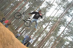 Ben Smith gets off his BMX at the Local Trails